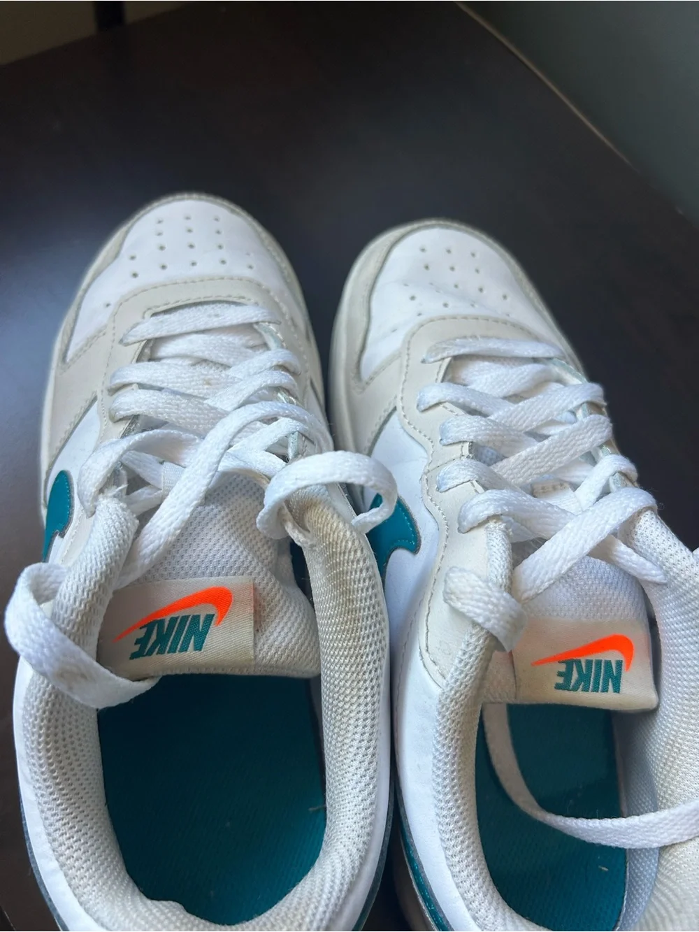 Nike White Low-Top Sneakers with Teal Swoosh Accent